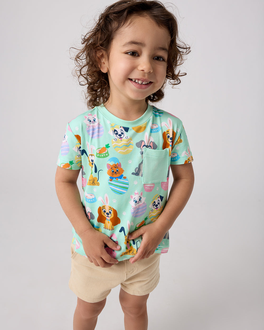 Boy wearing the Disney Peekaboo Pets Relaxed Pocket Tee with khaki shorts