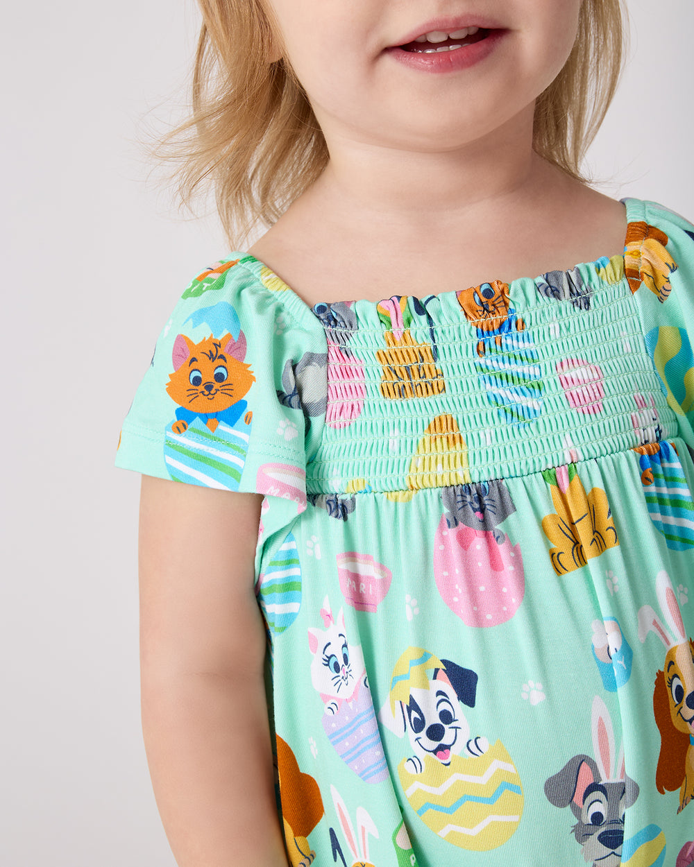 Close up of the smocked detail on the Disney Peekaboo Pets Smocked Flutter Romper