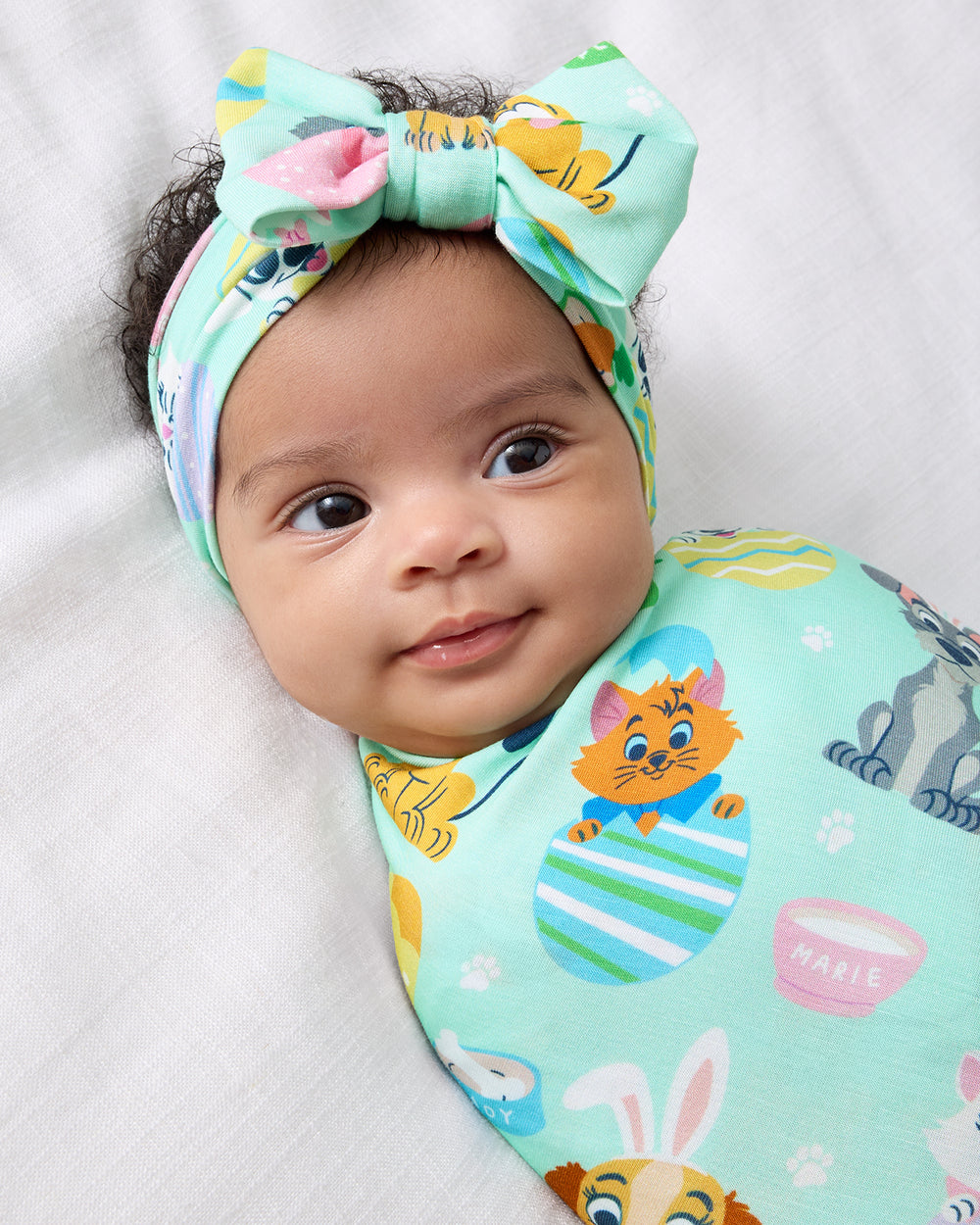 Alternate of baby wearing the Disney Peekaboo Pets Swaddle & Luxe Bow Headband Set