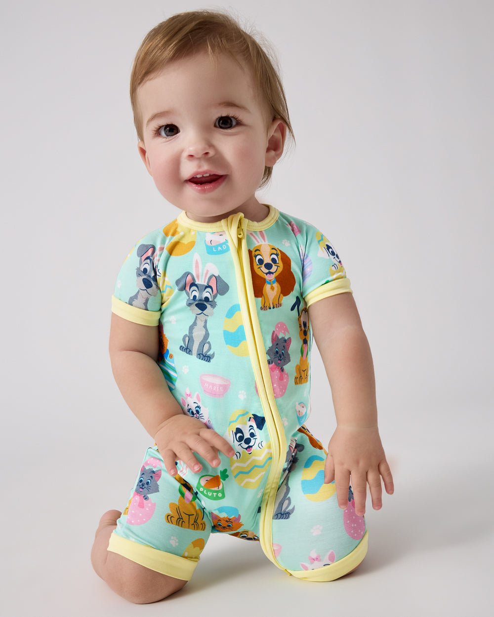 Baby wearing the Disney Peekaboo Pets Shorty Zippy