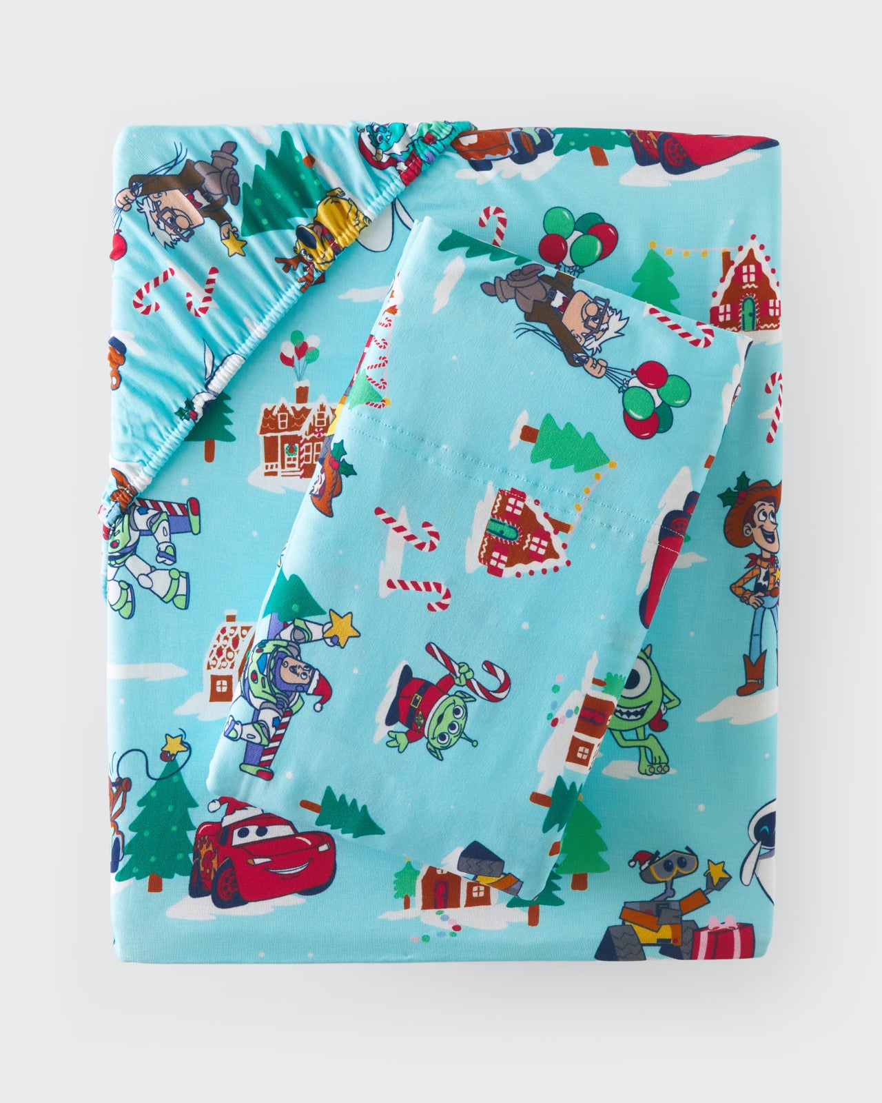 Flat lay of the Disney & Pixar Christmas Village Twin Sheet Set