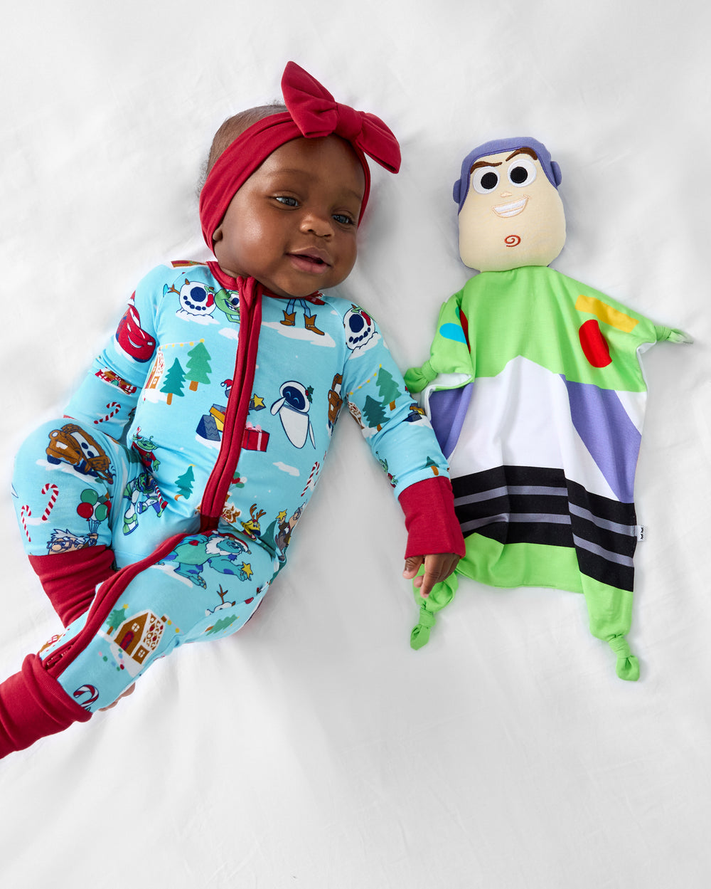 Baby laying with the Disney Toy Story Buzz Lightyear Lovey