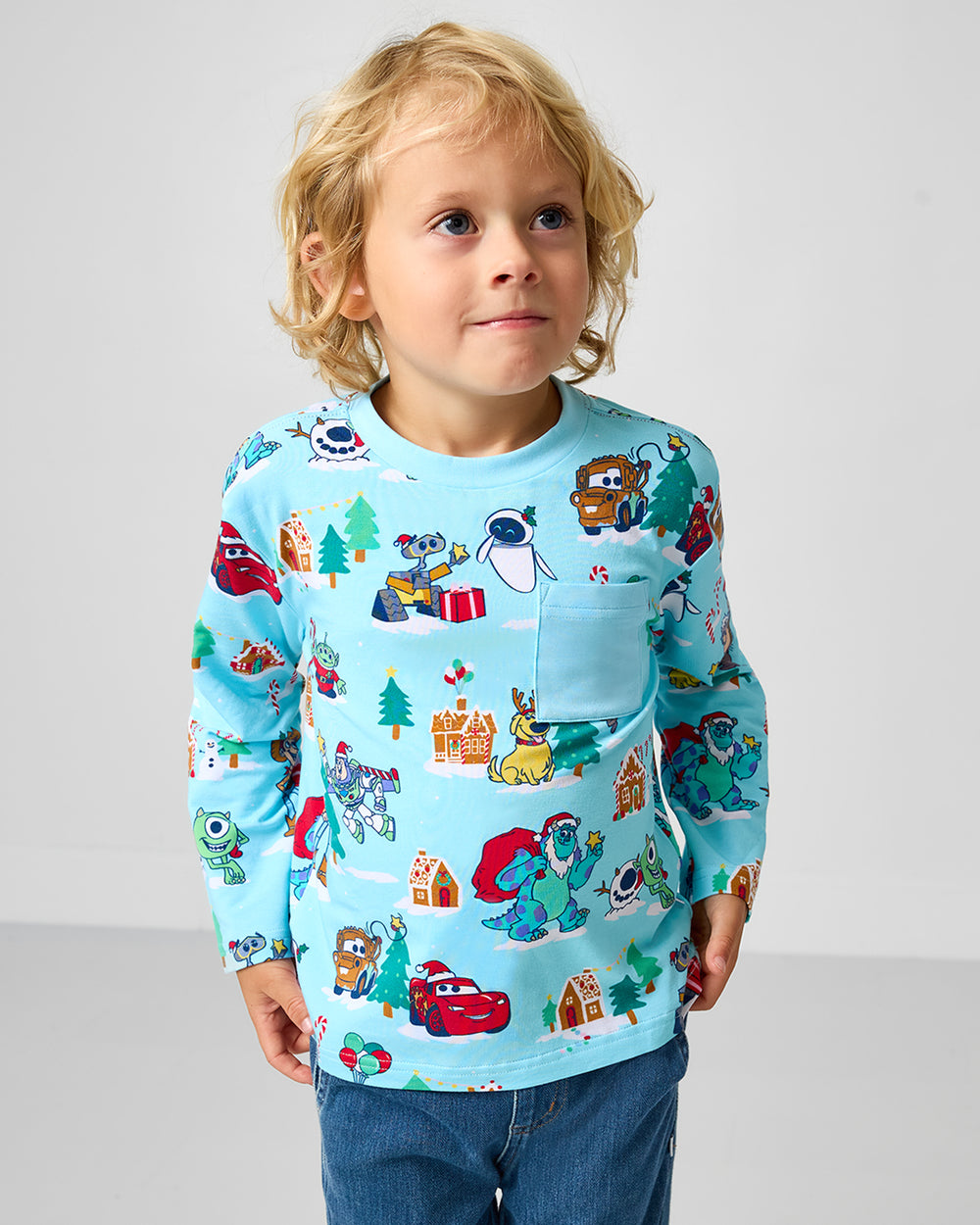 Child wearing the Disney & Pixar Christmas Village Relaxed Pocket Tee