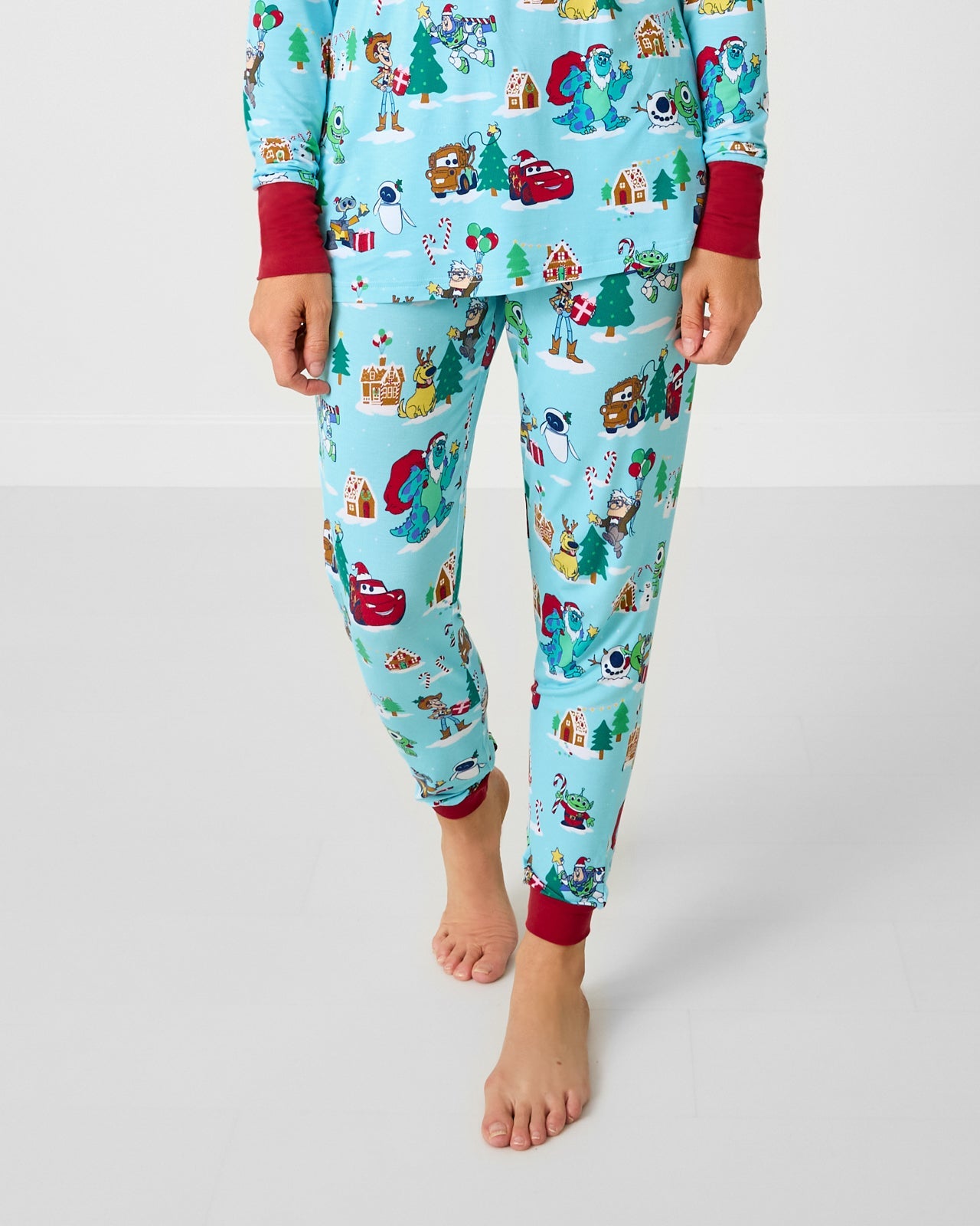 Woman wearing the Disney & Pixar Christmas Village Women's Pajama Pants