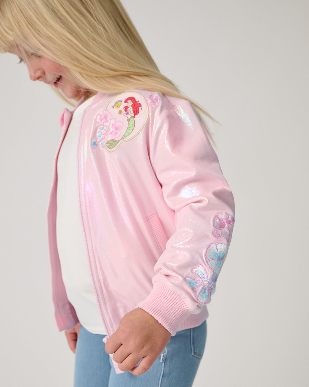 Close up of the sleeve detail on the Disney Princess Iridescent Varsity Jacket