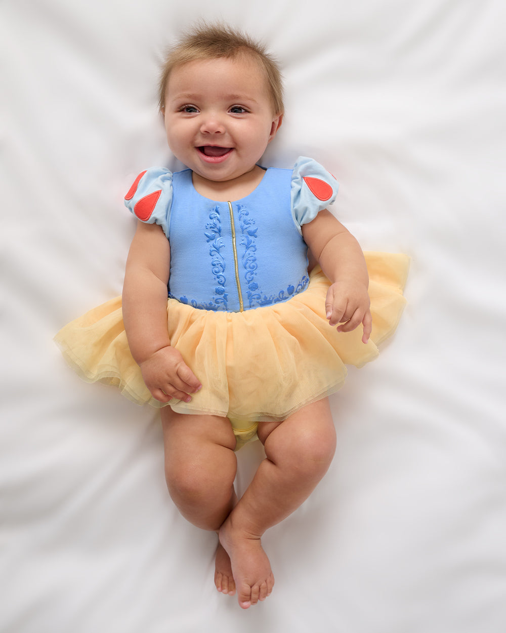 Aerial view of baby wearing the Disney Princess Snow White Dress with Bodysuit