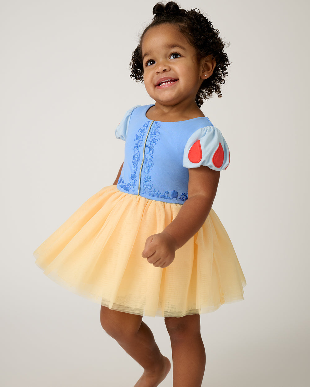 Walking toddler wearing the Disney Princess Snow White Dress with Bodysuit