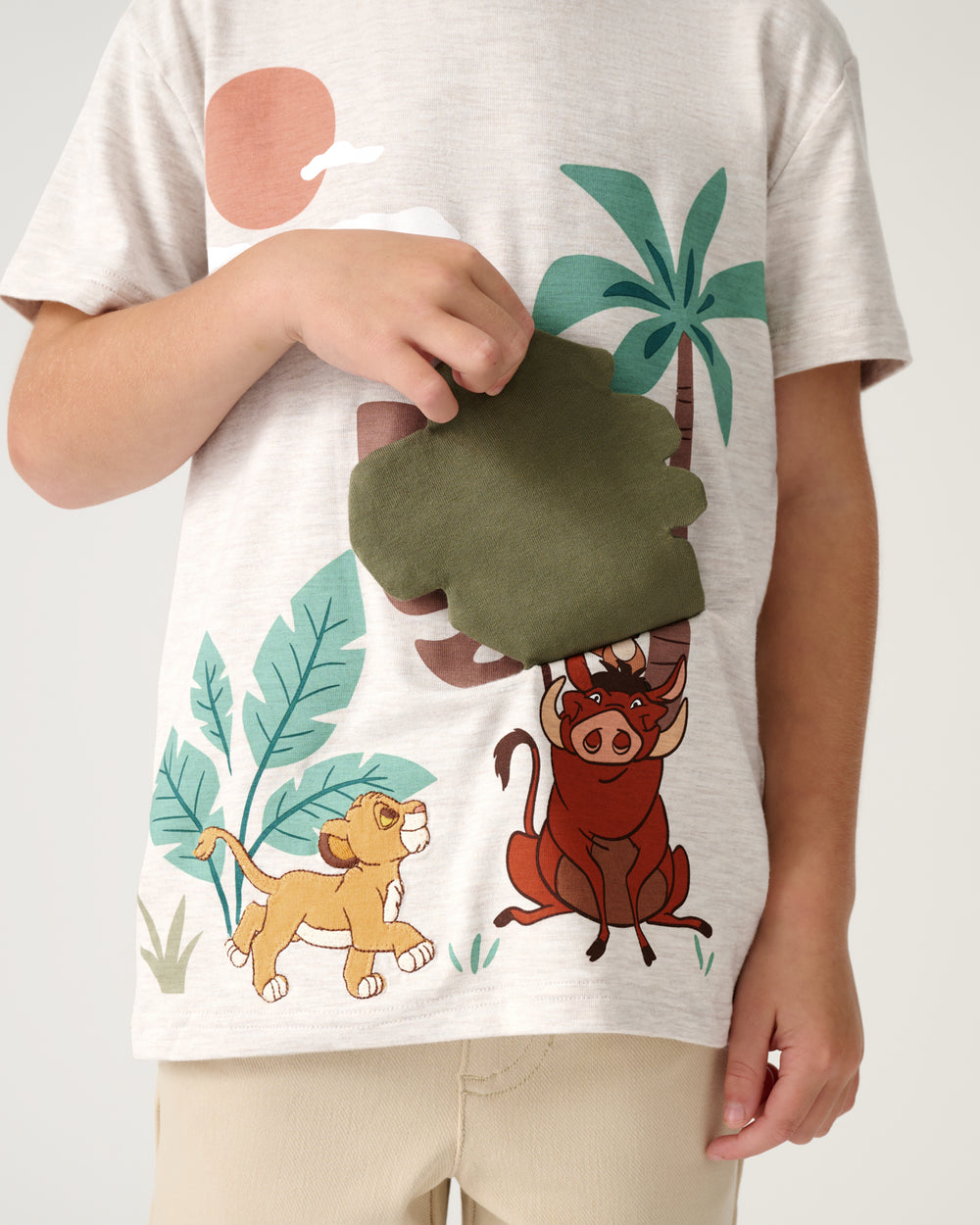 Boy lifting the leaf flap detail on the Disney Safari Hideaway Relaxed Tee