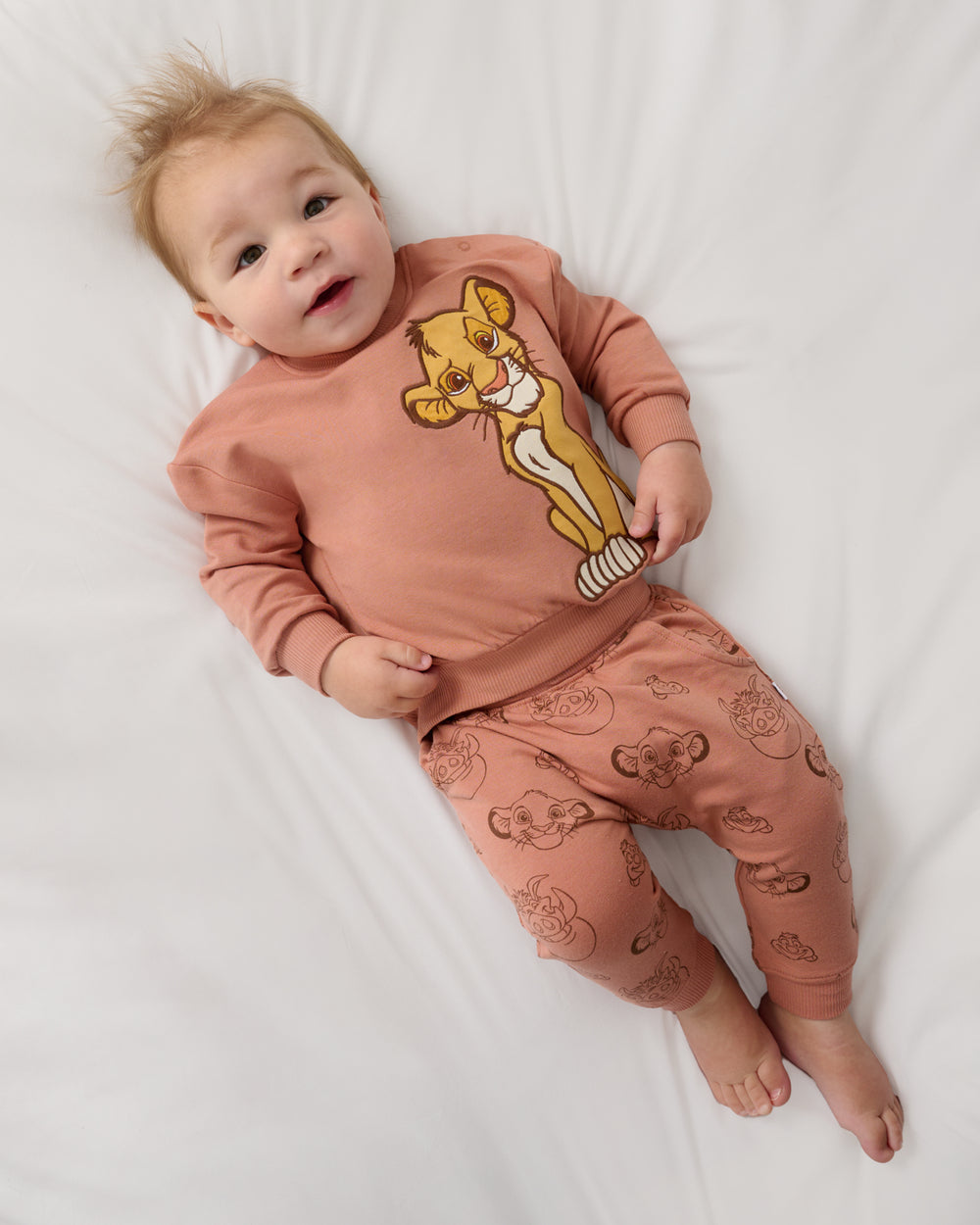 Aerial view of baby wearing the Disney Simba Easy Crewneck Sweatshirt and Joggers