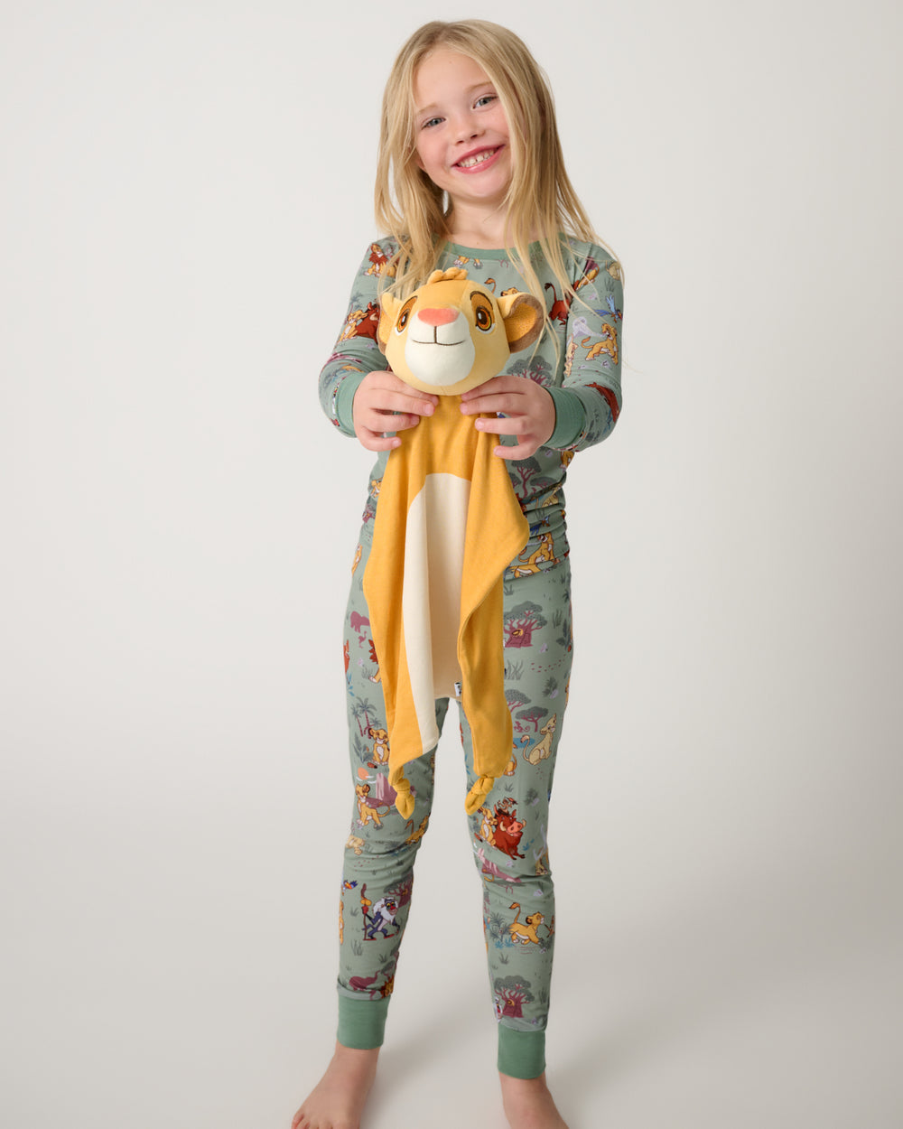 Standing girl holding the Disney Simba Lovey