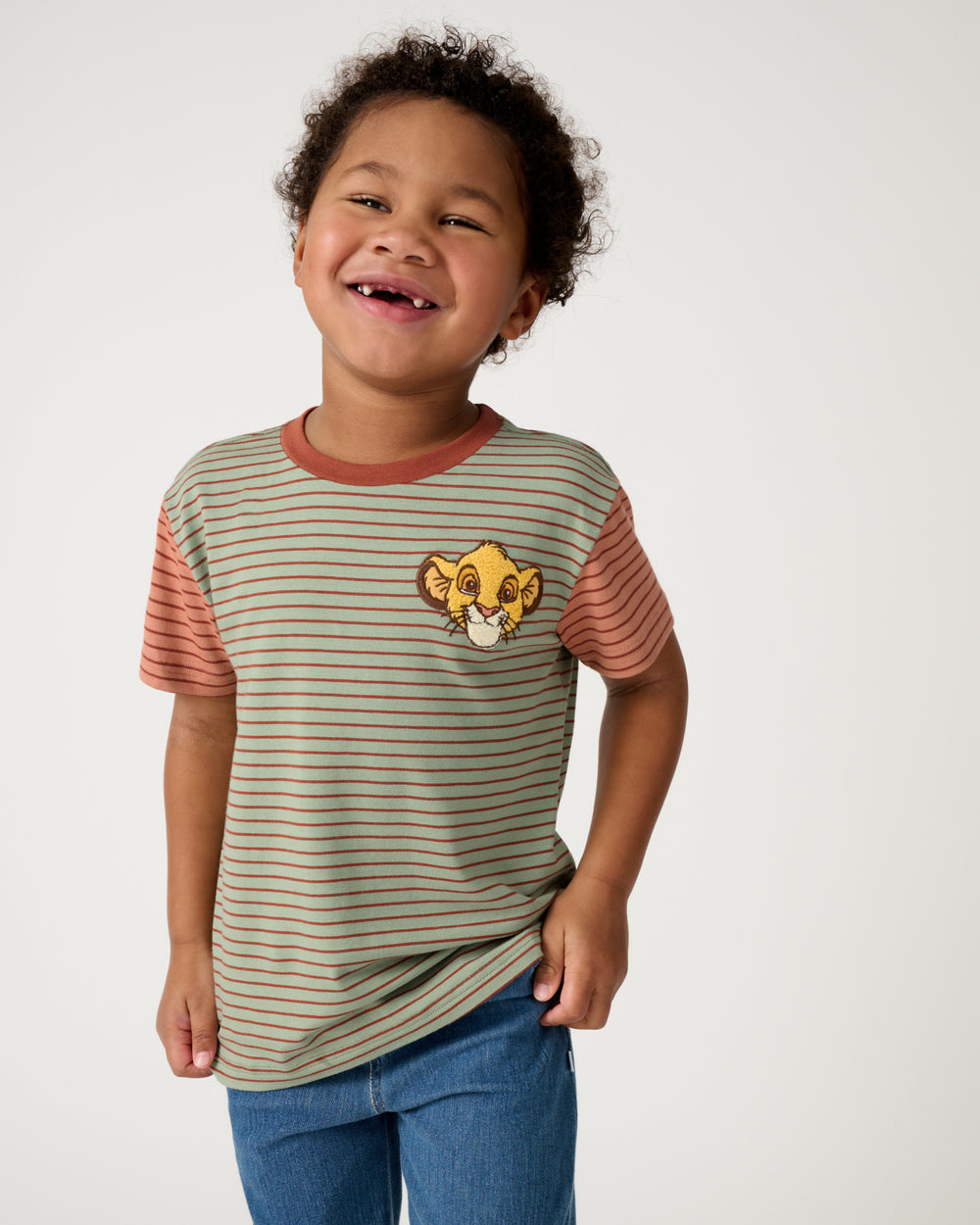 Boy wearing the Disney Simba Stripe Relaxed Tee