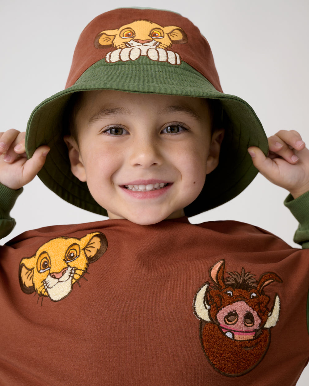 Close up of boy wearing the Disney Simba Bucket Hat