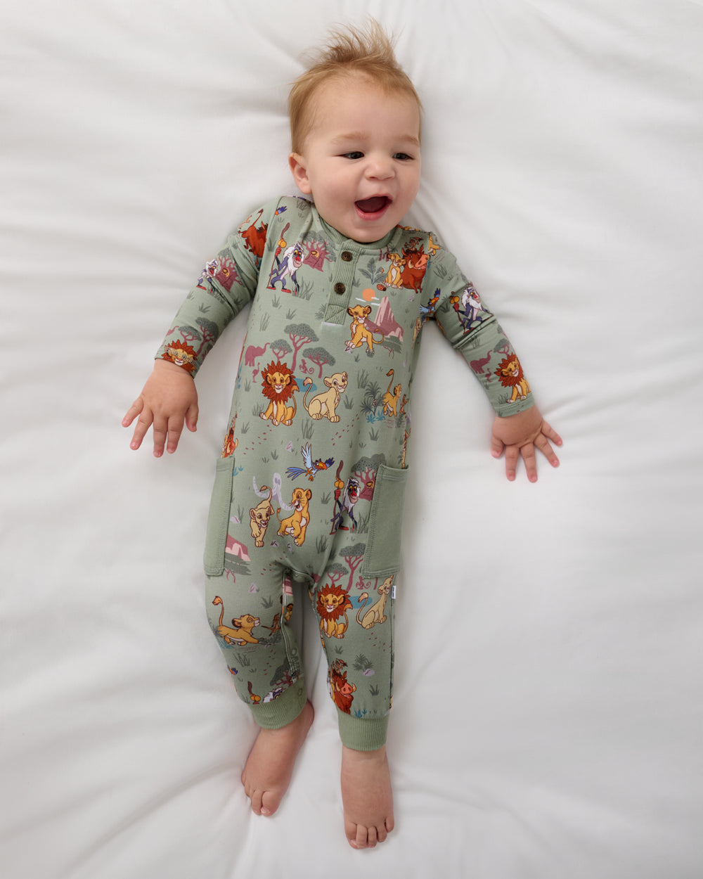 Aerial view of baby wearing the Disney Simba's Safari Henley Romper