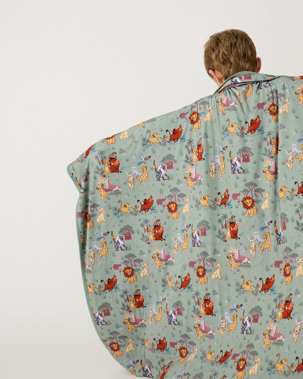 Back view of child holding up the Disney Simba's Safari Large Cloud Blanket®