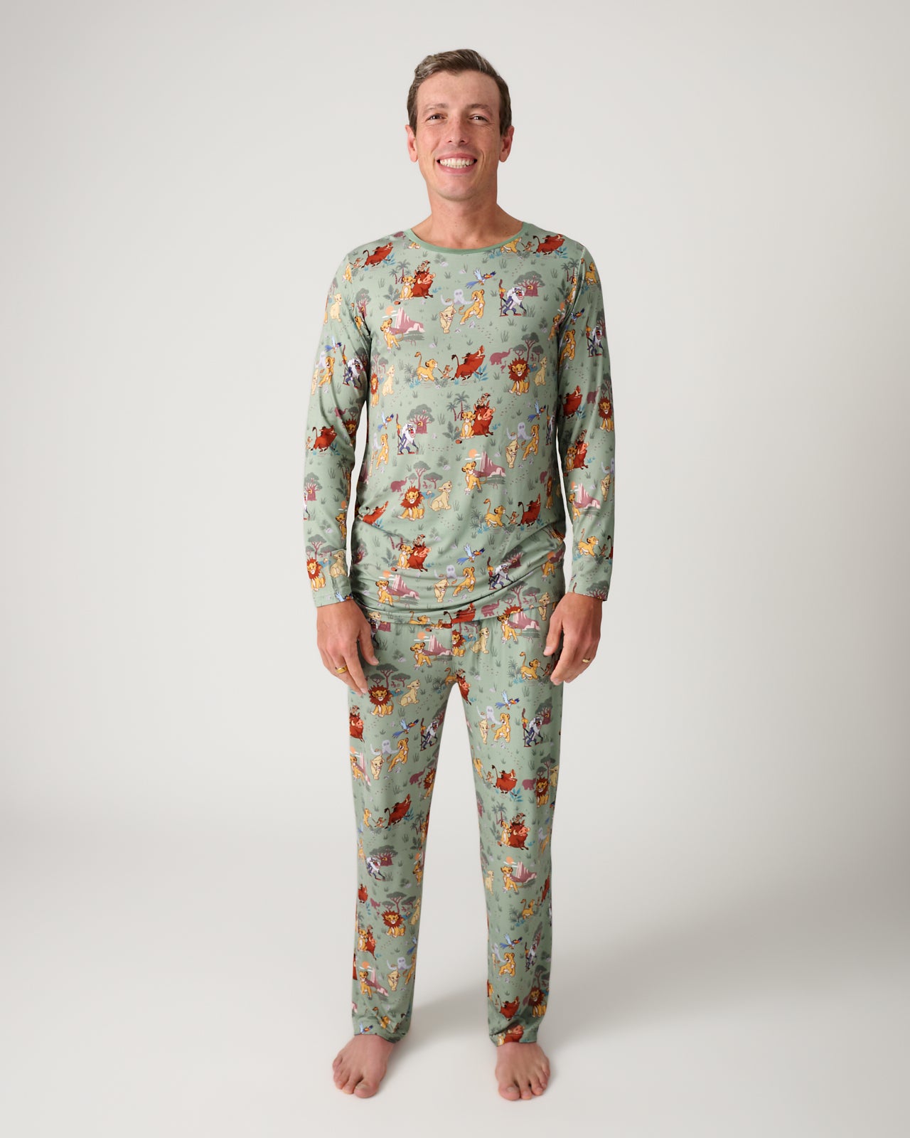 Man wearing the Disney Simba's Safari Men's Pajama Pants and Top
