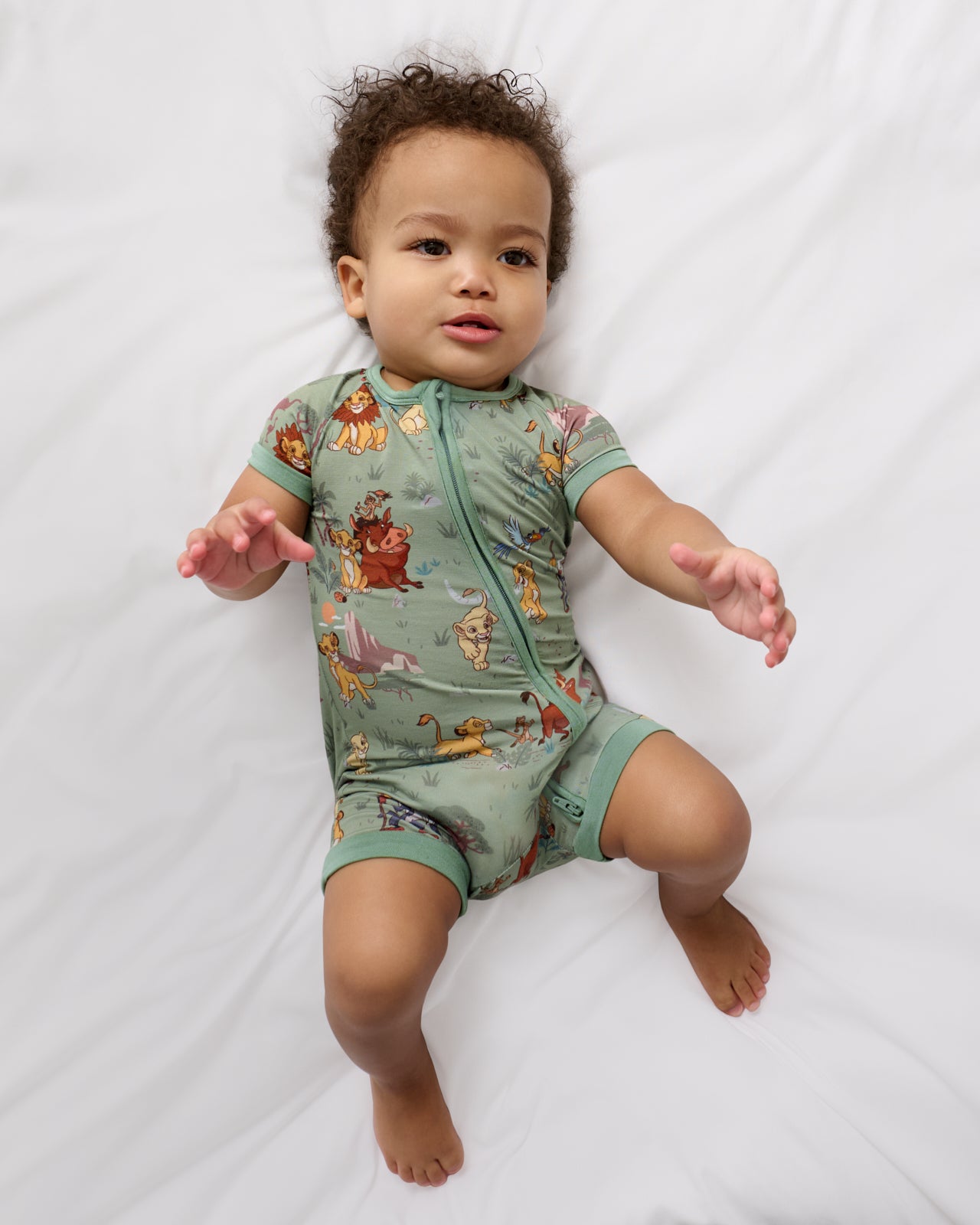 Aerial view of baby wearing the Disney Simba's Safari Shorty Zippy