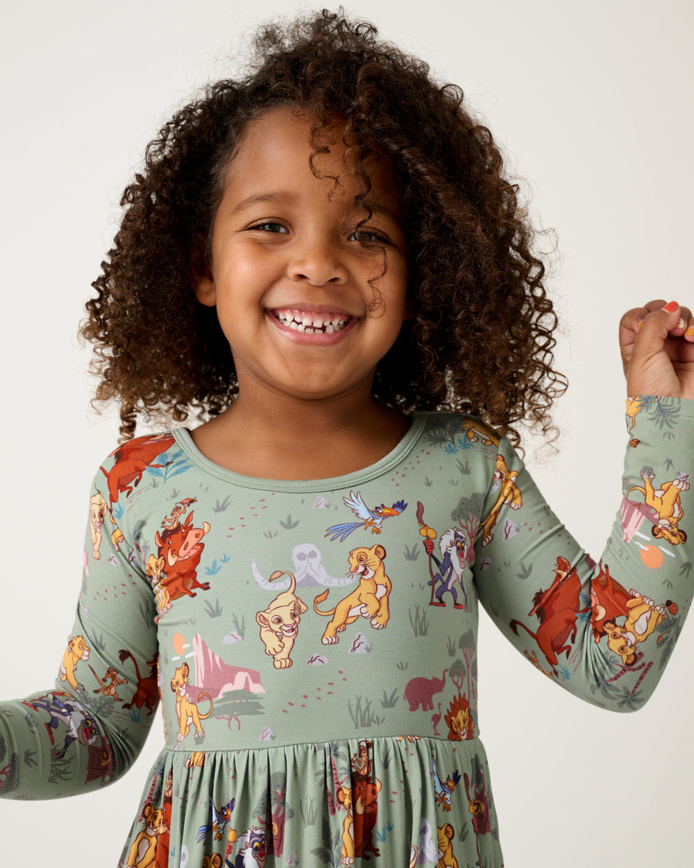 Close up of girl wearing the Disney Simba's Safari Skater Dress