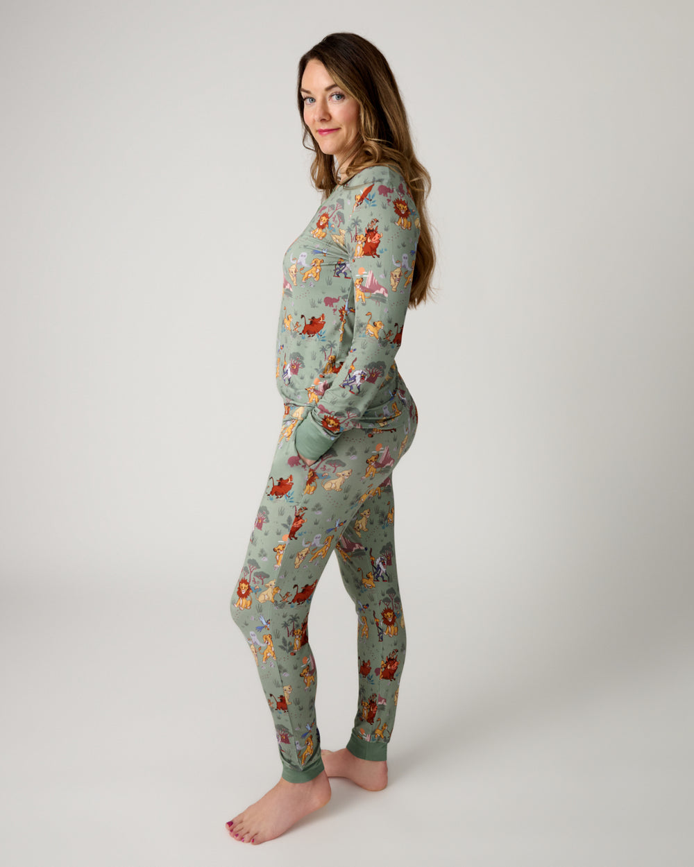 Side view of woman wearing the Disney Simba's Safari Women's Pajama Pants and Top