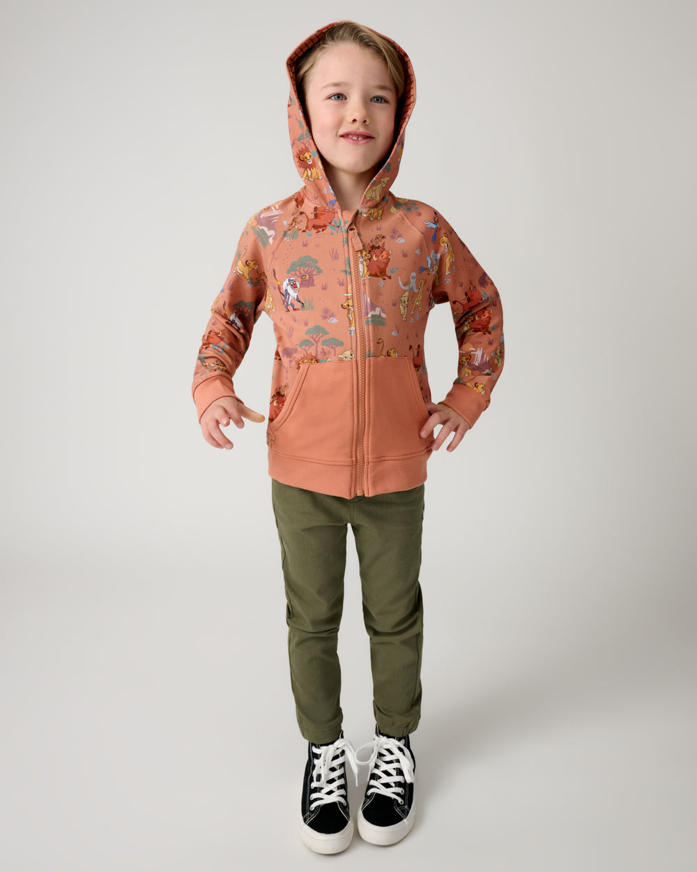 Boy wearing the Disney Simba's Safari Zip Hoodie with the hood on