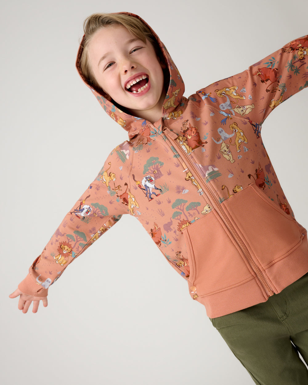 Posing boy wearing the Disney Simba's Safari Zip Hoodie