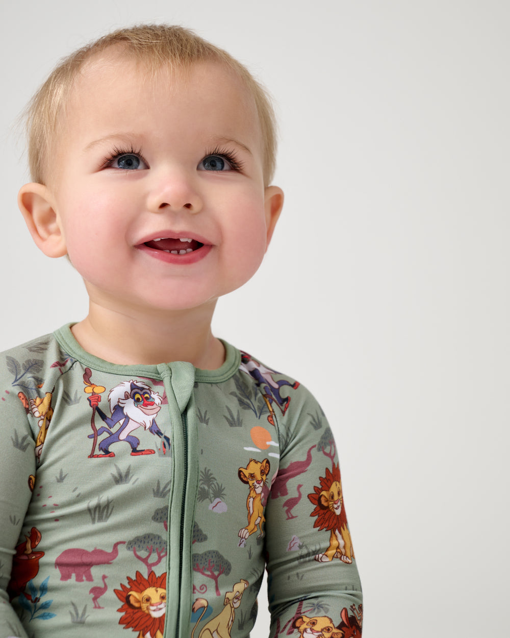 Close up of baby wearing the Disney Simba's Safari Zippy