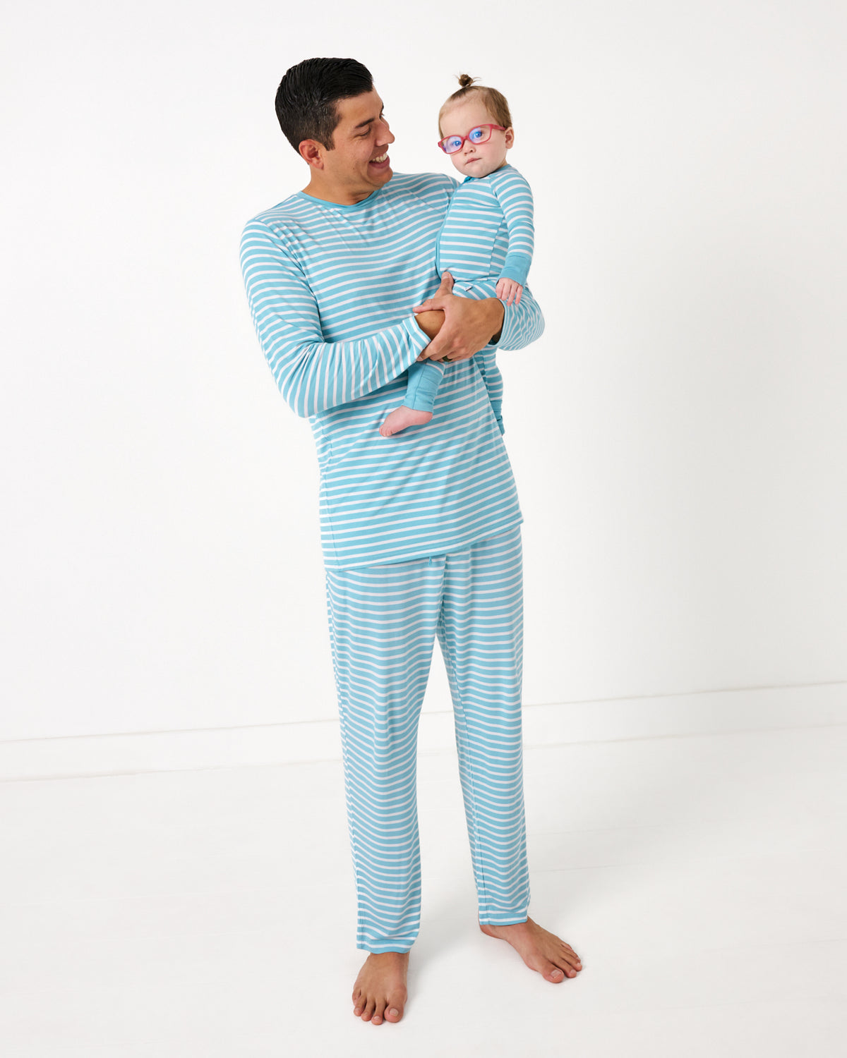 Father and child wearing matching Dockside Stripe bamboo pajamas