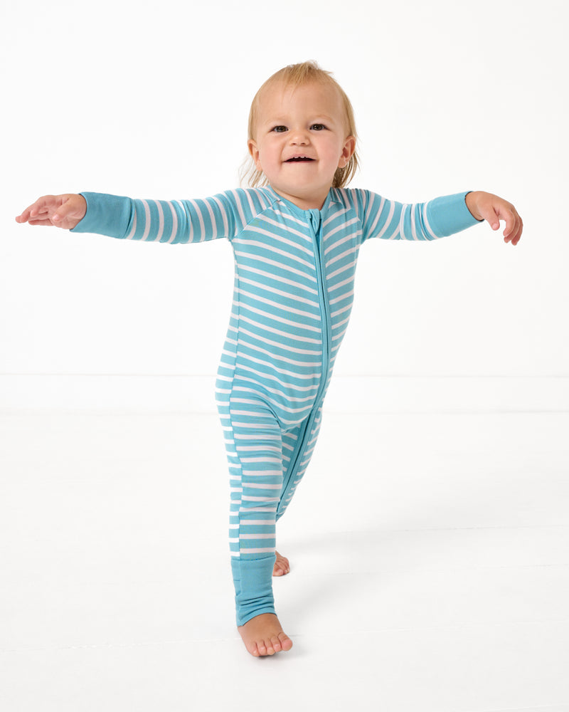 Walking toddler wearing the Dockside Stripe Zippy