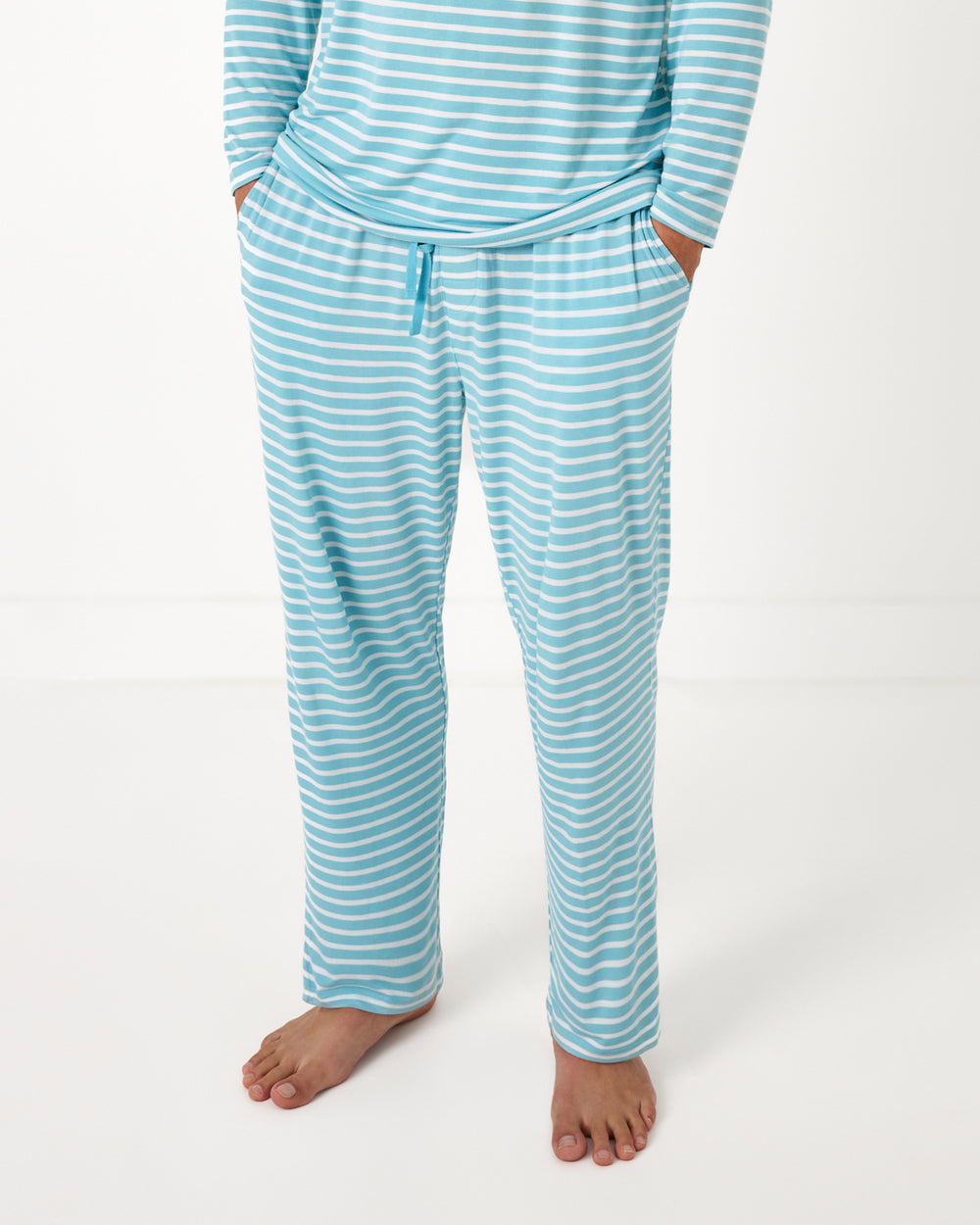 Man wearing the Dockside Stripe Men's Pajama Pants