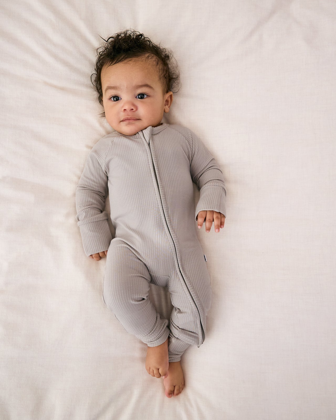 Aerial view of child wearing the Dove Gray Ribbed Zippy