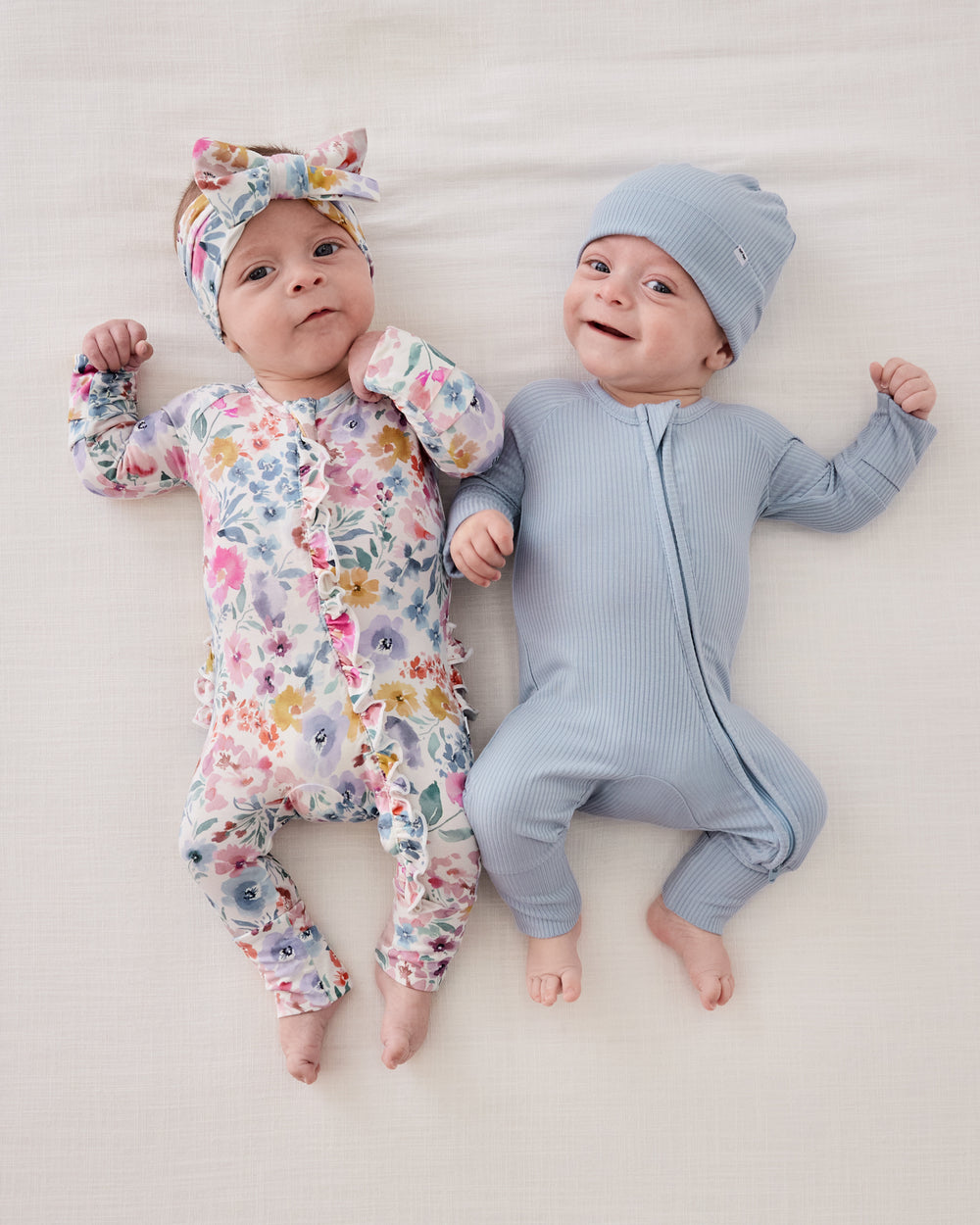 Brother and sister matching in zippies from the Newborn Capsule
