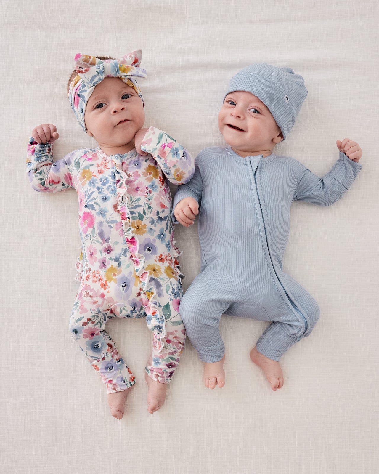 Brother and sister matching in zippies from the Newborn Capsule