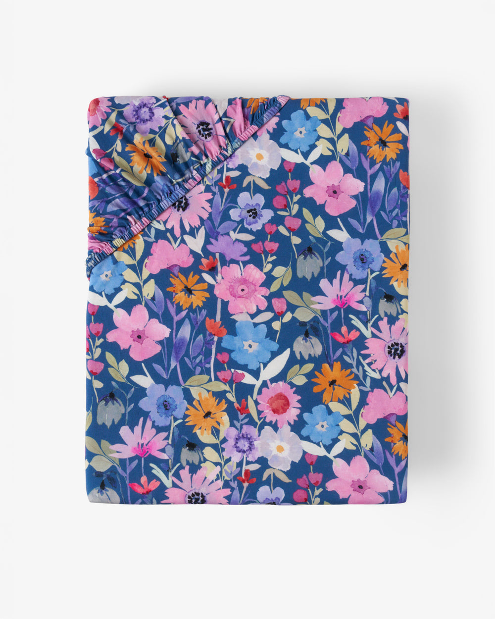 Flat lay of the Dusk Blooms Fitted Crib Sheet