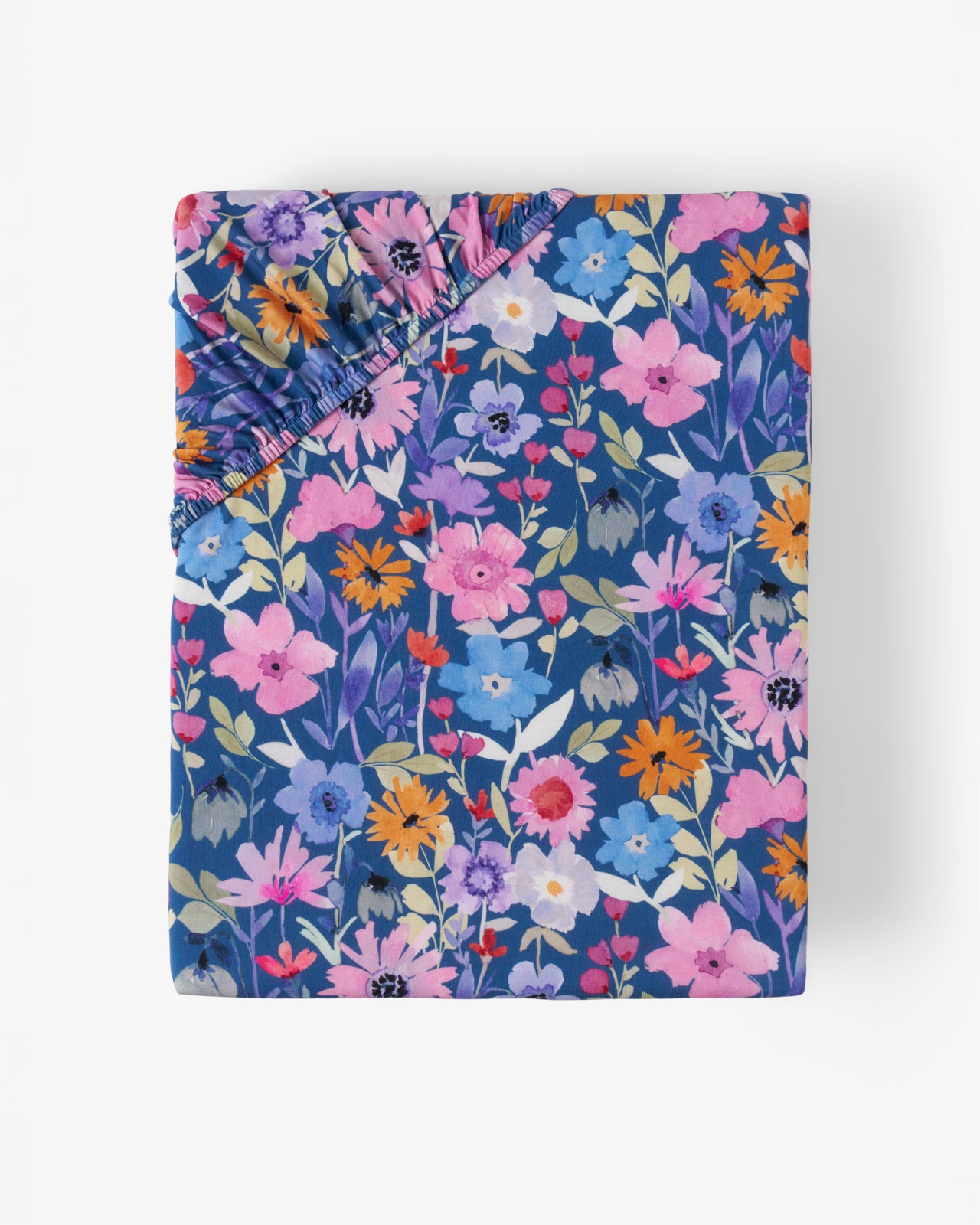 Flat lay of the Dusk Blooms Fitted Crib Sheet