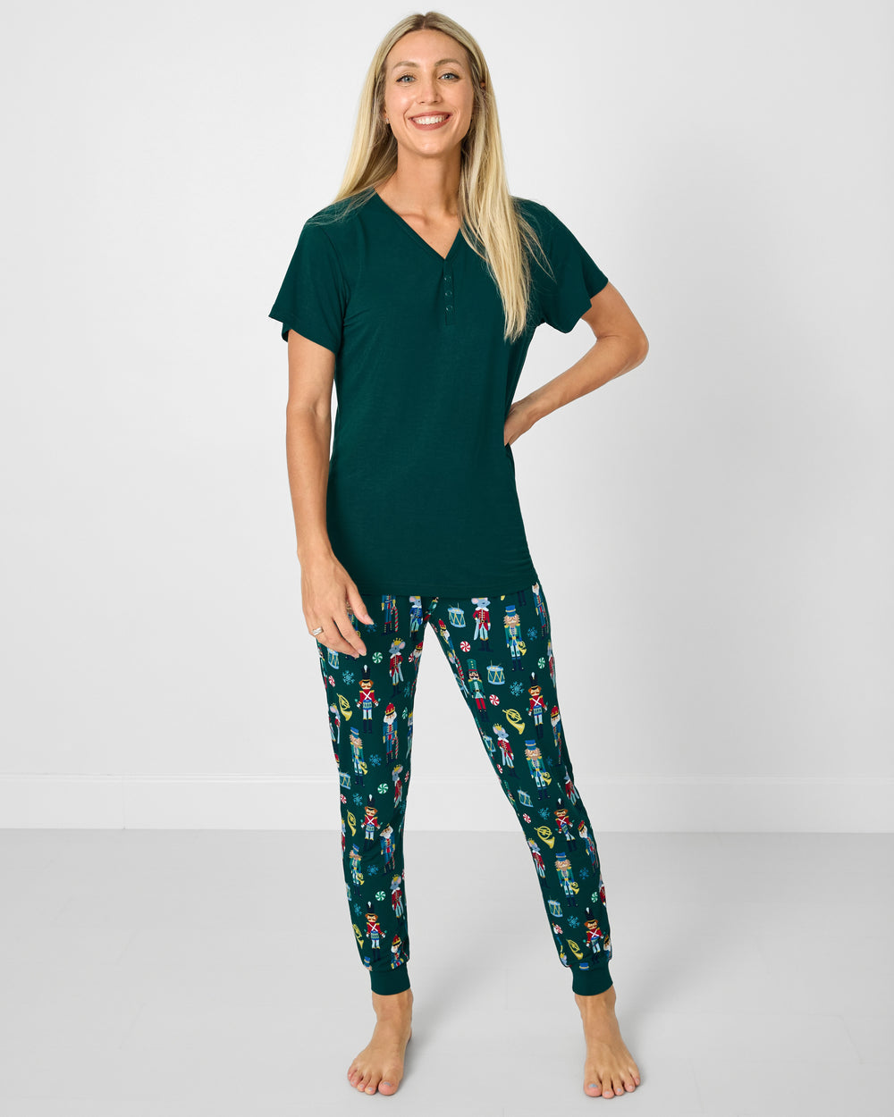 Woman wearing the Emerald Women's Short Sleeve Pajama Top with Nutcracker March pajama pants