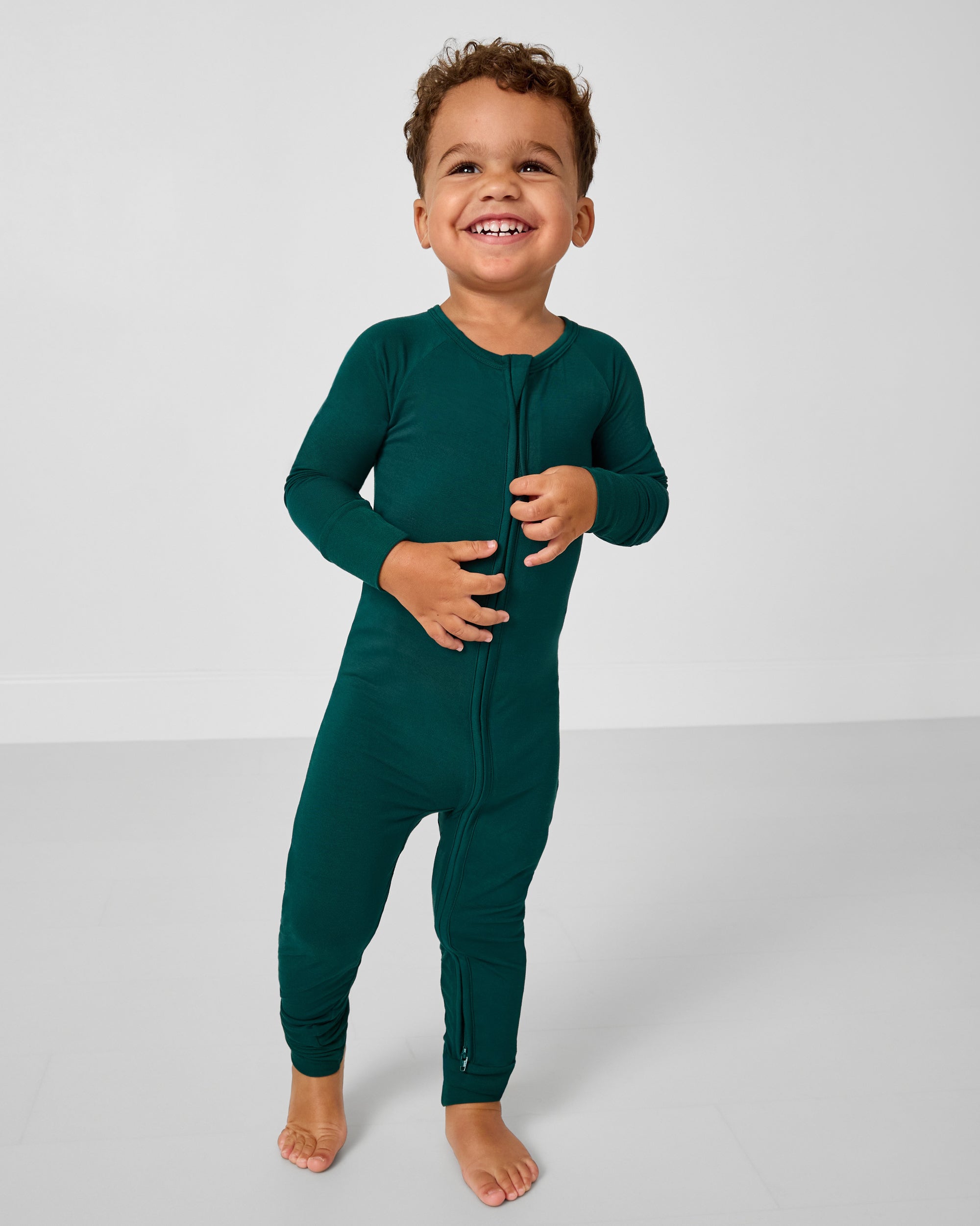 Standing toddler wearing the Emerald Zippy