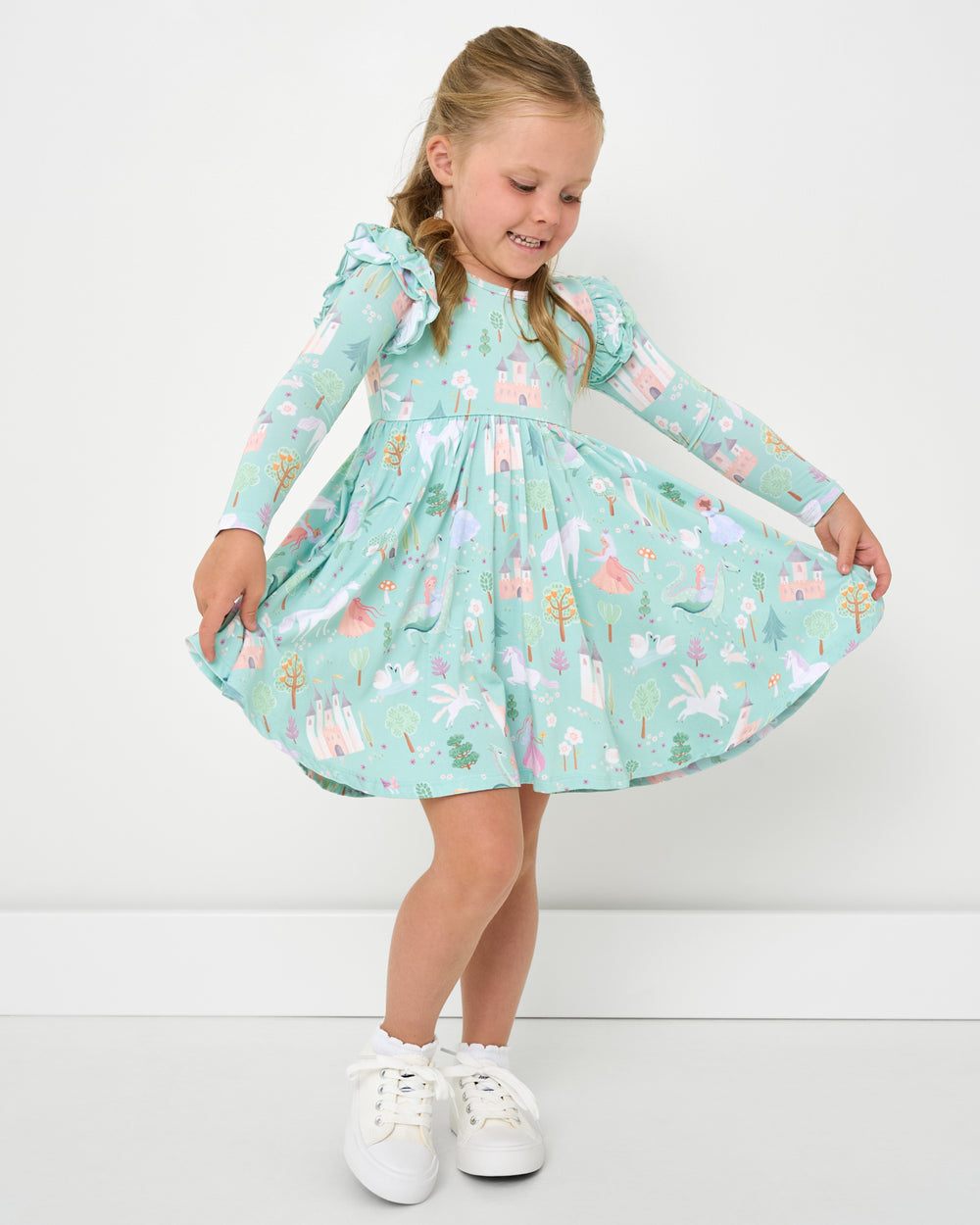 Girl holding out the skirt on the Enchanted Fairytale Flutter Twirl Dress 