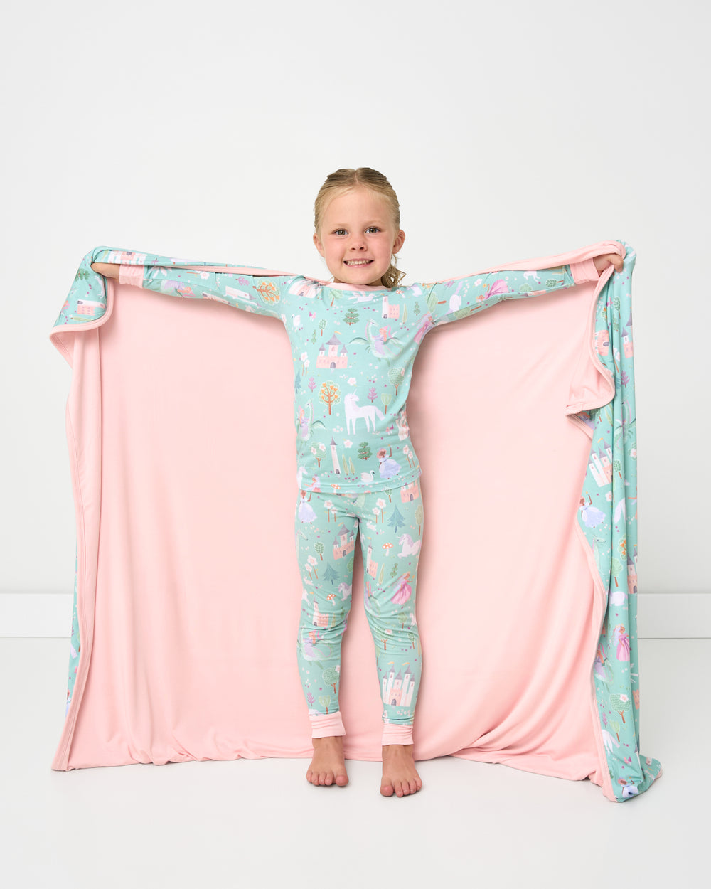 Girl holding out the showing the solid pink side