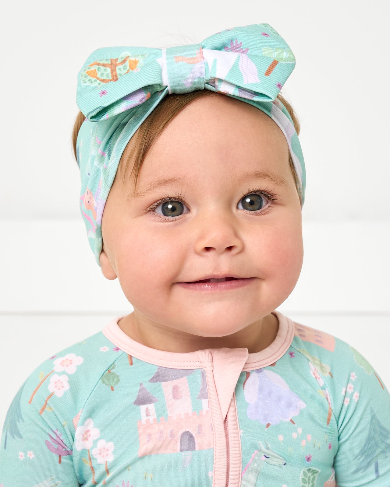 Close up of baby wearing the Enchanted Fairytale Luxe Bow Headband