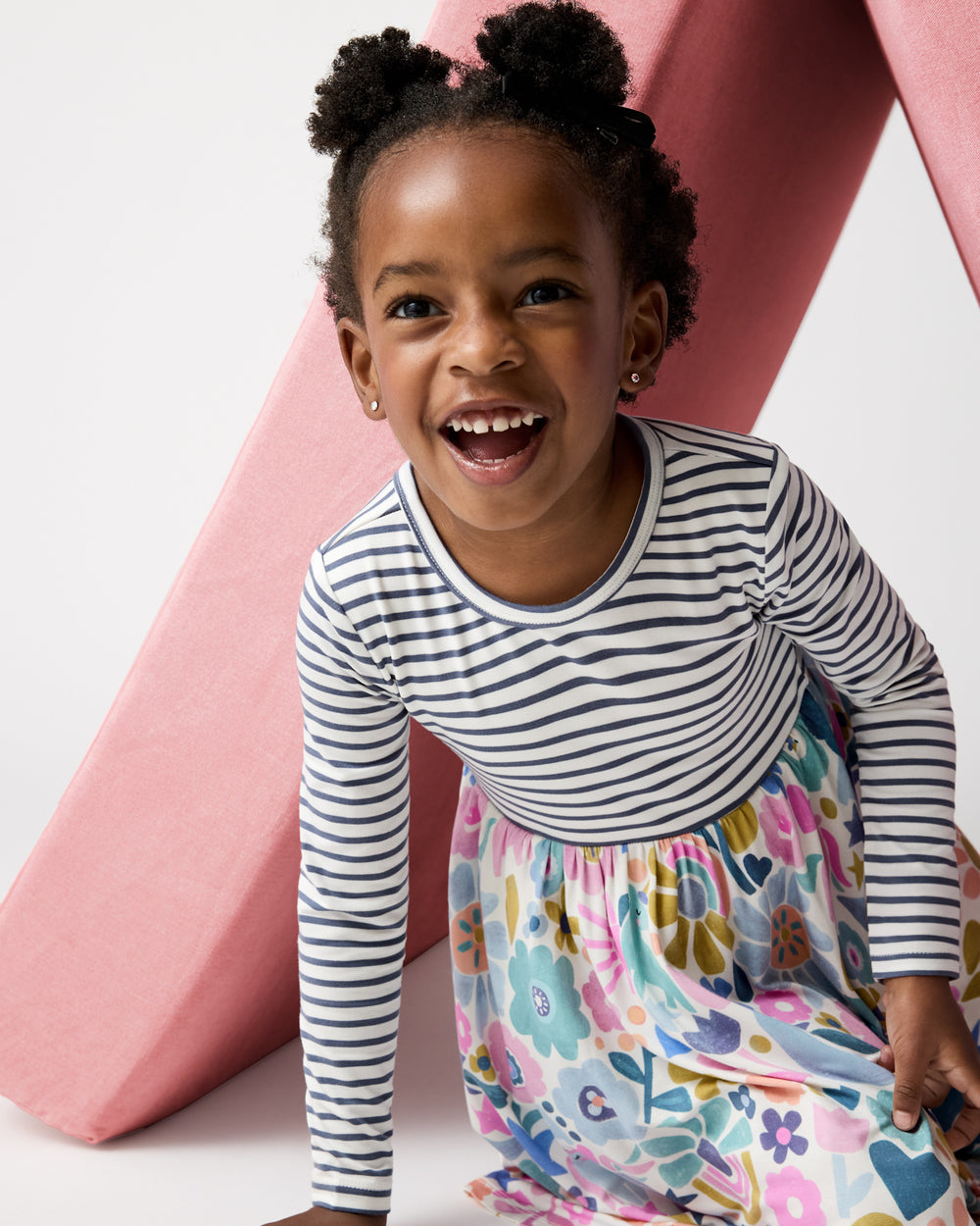 Girl wearing the Unicorn Blossoms Twirl Dress from the Winter Play drop