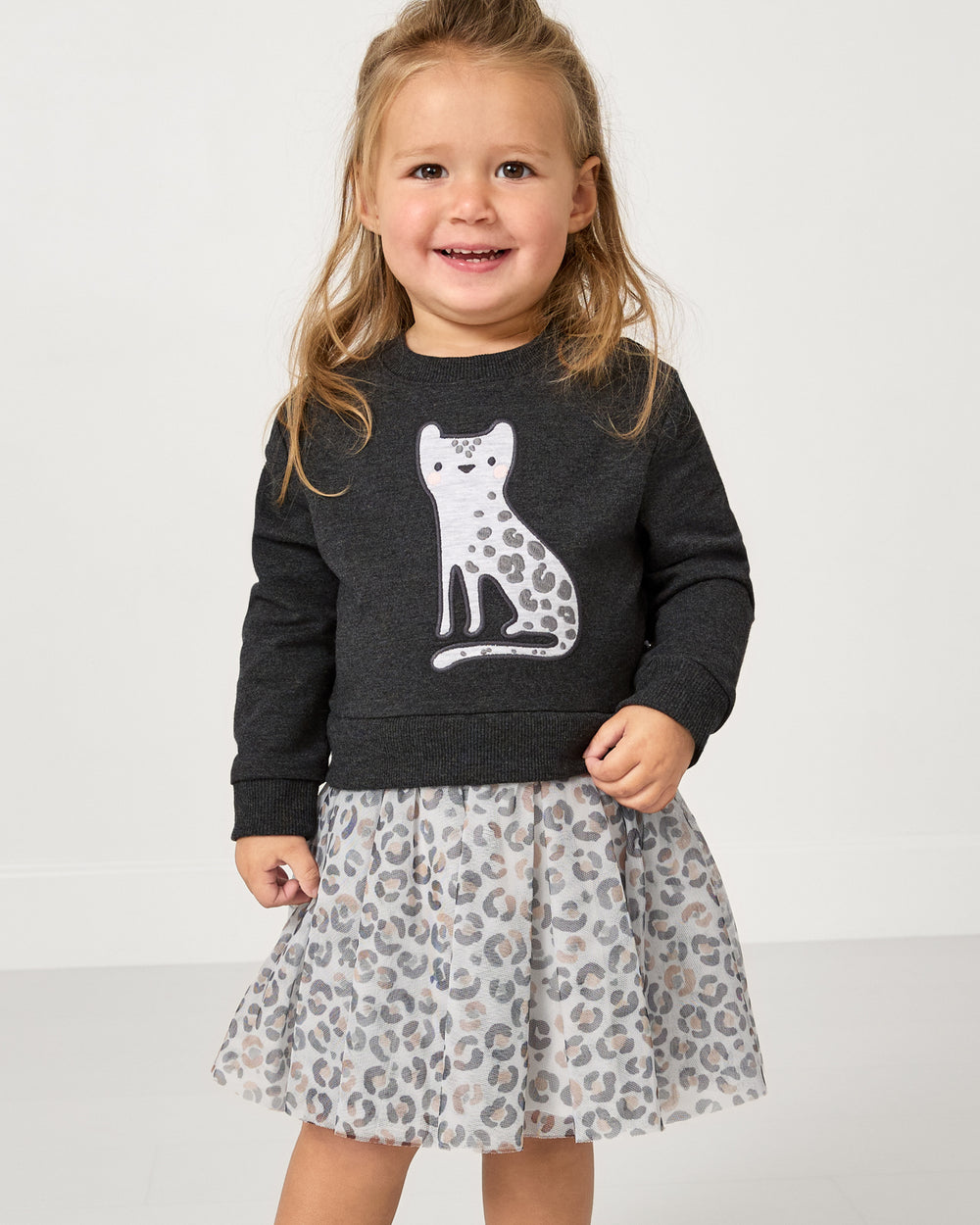 Girl wearing the Snowy Leopard Crewneck Tutu Dress