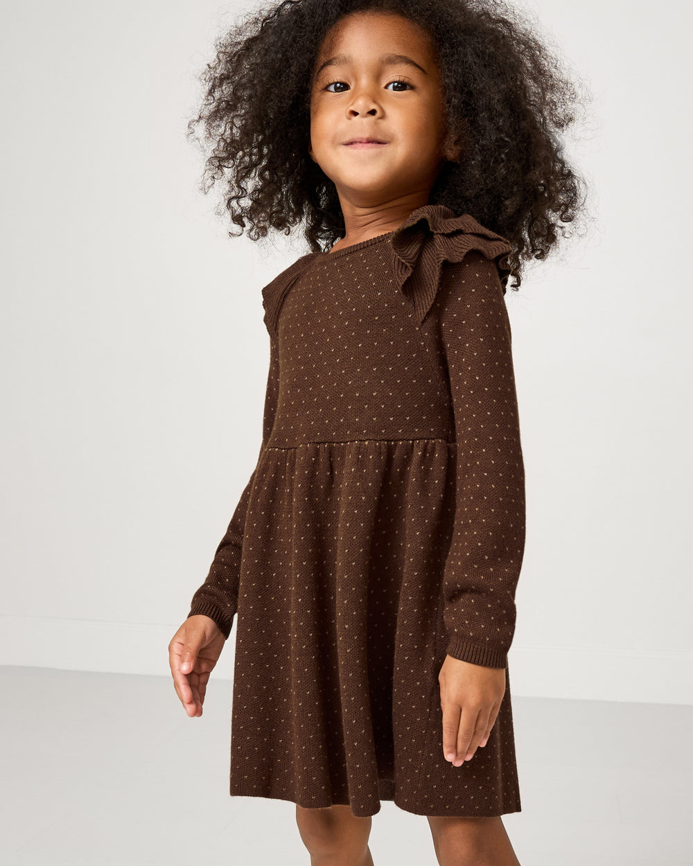 Girl wearing the Mocha Ruffle Sweater Dress