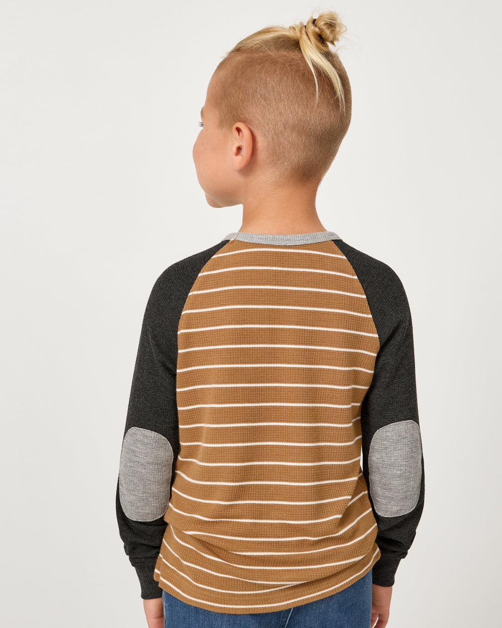 Back view of child wearing the Cider Stripe Waffle Raglan Tee