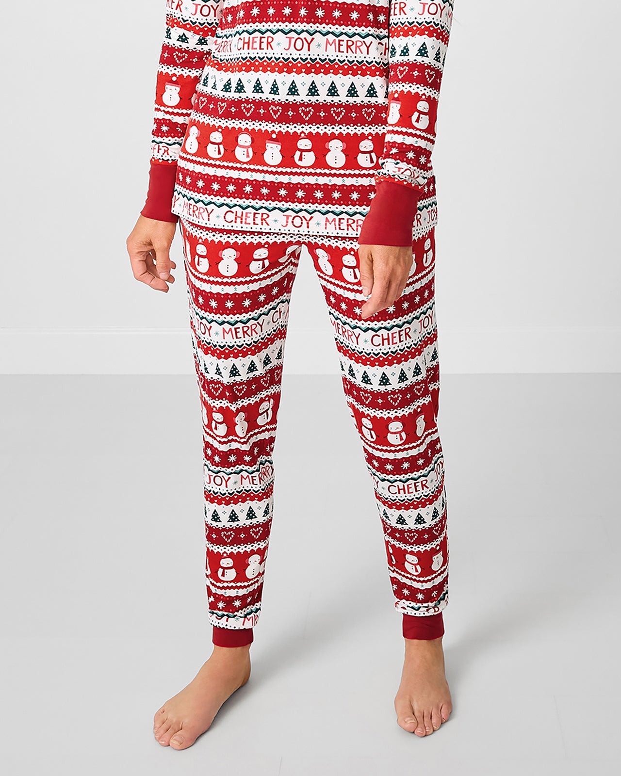 Woman wearing the Festive Fair Isle Women's Pajama Pants with the coordinating pajama top