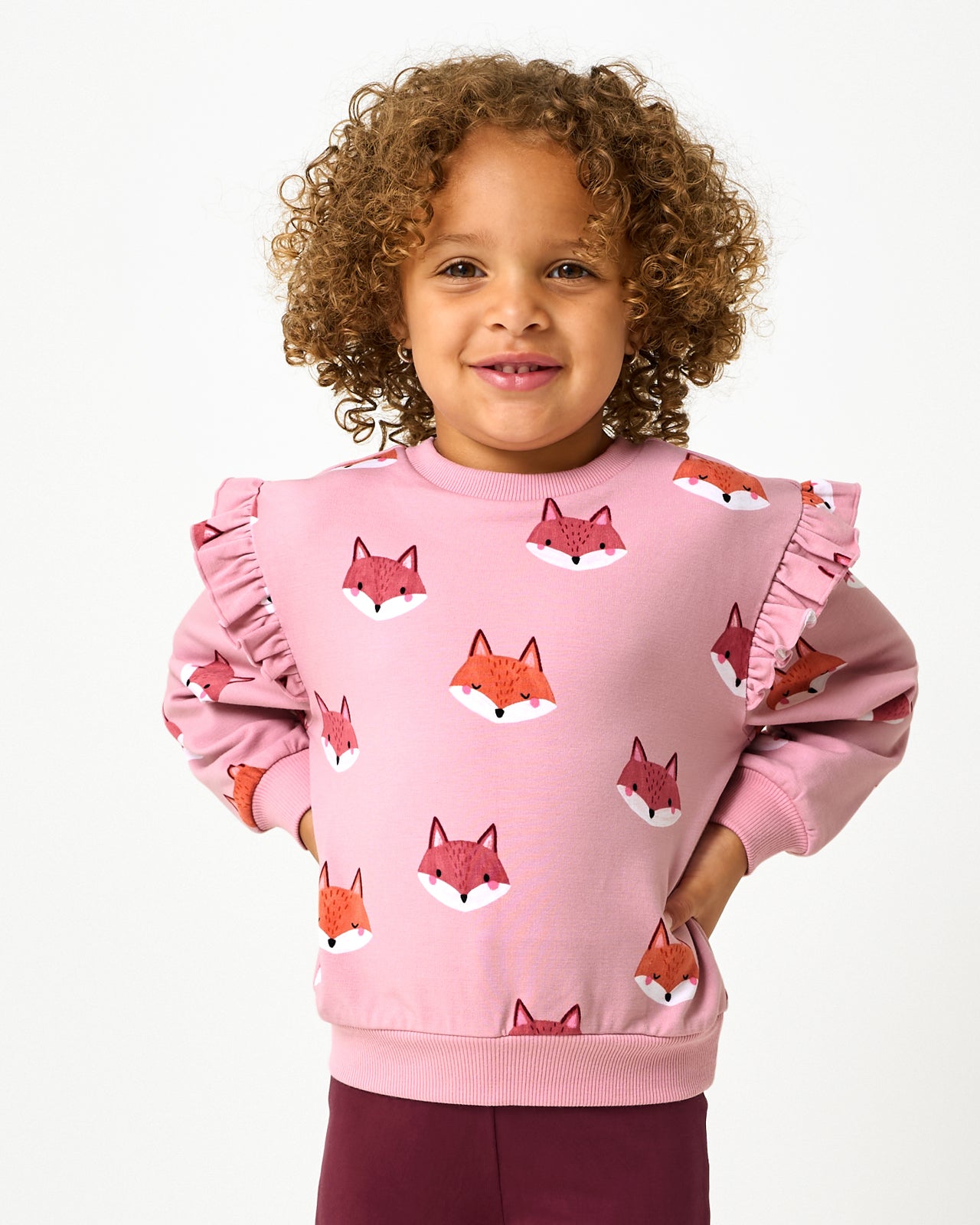 Girl wearing the Fox Tracks Flutter Crewneck