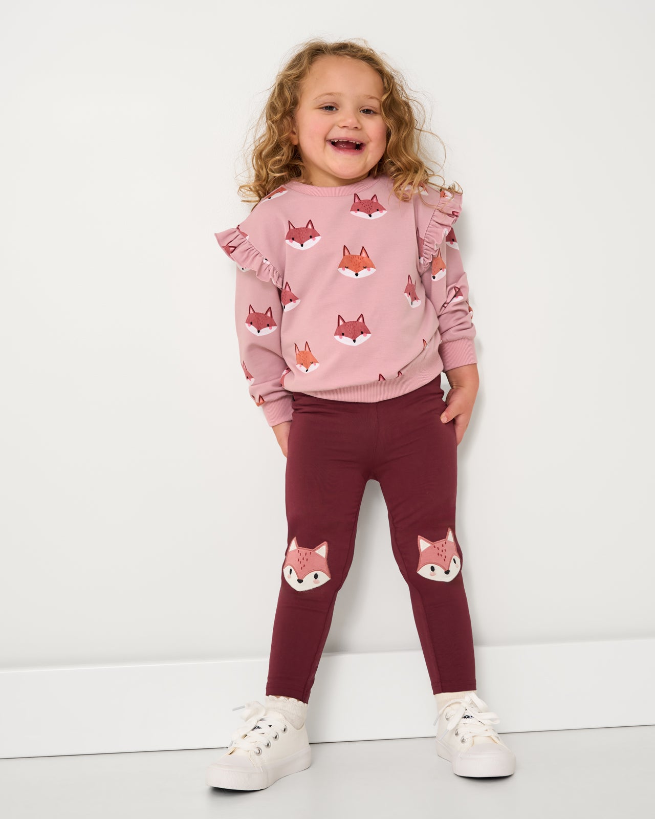 Alternate girl wearing the Fox Tracks Flutter Crewneck with coordinating leggings