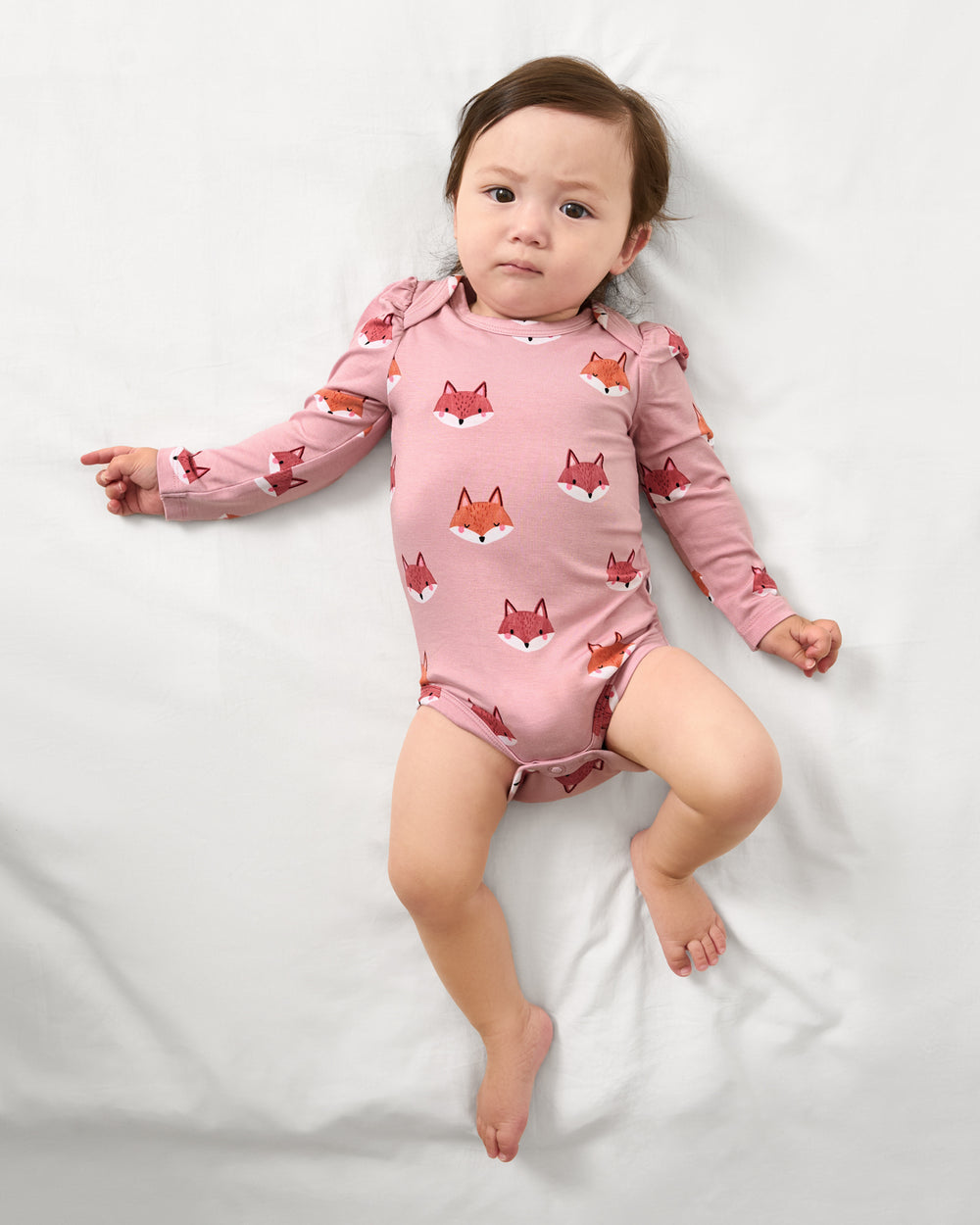 Aerial view of baby wearing the Fox Tracks Puff Sleeve Bodysuit