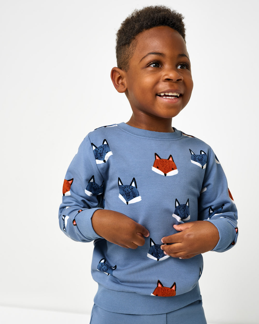 Boy wearing the Fox Tracks Crewneck Sweatshirt