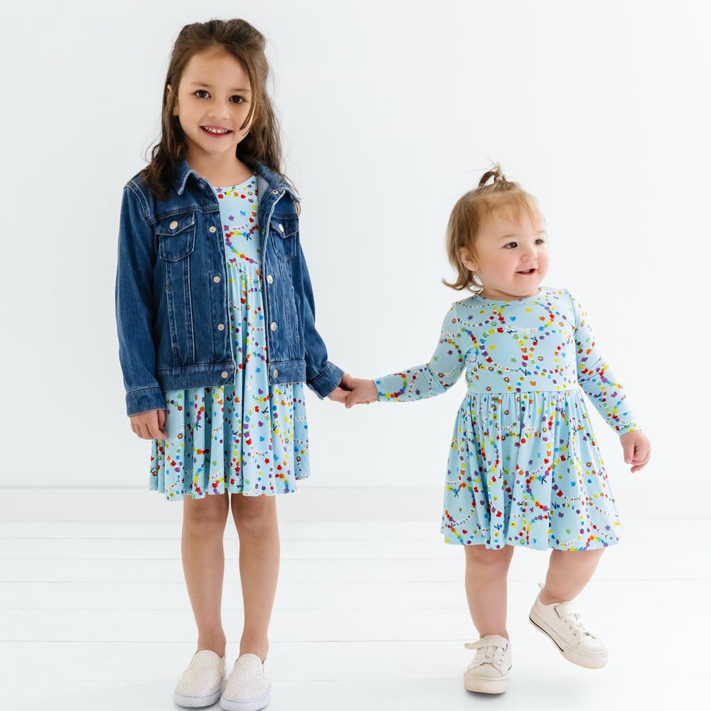 Two children in matching Friends Forever dress styles