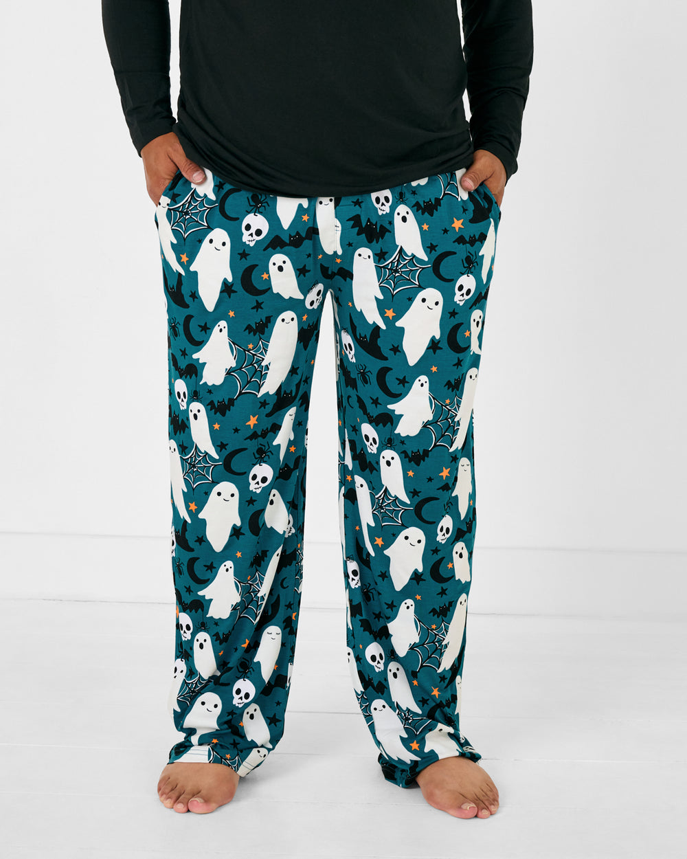 Standing man wearing the Frightful Friends Men's Pajama Pants