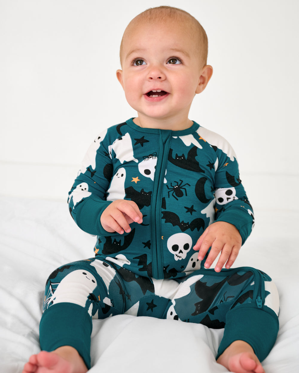 Sitting baby wearing the Frightful Friends Zippy